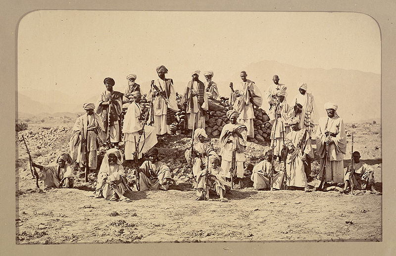 ''Photograph of a group of Afridis taken by John Burke in 1878. Burke accompanied the Peshawar Valley Field Force, one of three British Anglo-Indian army columns deployed in the Second Afghan War (1878-80), despite being rejected for the role of official photographer. He financed his trip by advance sales of his photographs 'illustrating the advance from Attock to Jellalabad'.''