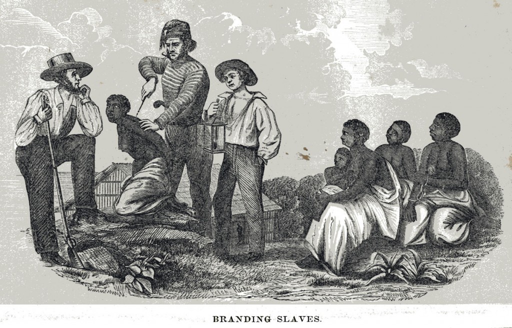 1857: A slave owner brands his slaves in order to help him "keep track of 