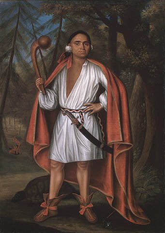 "Verelst depicted the four representatives of the Haudenosaunee (Iroquois) alliance in a style reserved for royalty. Each full-length figure is posed in a stance associated with those wielding power, their gaze directed at the viewer. Mahican Etow Oh Koam (baptized Nicholas) wears or holds items that refer to his status, such as the carved wooden ball-headed club which identifies him as a warrior."