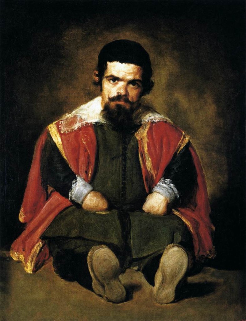 ---Although the dwarf Don Sebastián de Morra is portrayed in full figure, he is not standing in a self-confident pose or elegantly seated on a chair, but is sitting on the bare earth with his feet stretched out in front of him. This low position not only shows up the sumptuous clothing for the clownish apparel it is, but also heightens the intended effect: the court fool is at the mercy of the spectator. Such pictorial devices reveal the voyeurism with which the royal rulers made these people the objects of their shameless whimsy, caprice and power. At the same time, however, the artist is also making another statement: this court fool is giving nothing away, neither a smile, nor any buffoonery. Immobile, scrutinizing and impenetrable, his dark eyes are fixed on the spectator, who somehow feels caught out by such a gaze and turns away.---click image for source...