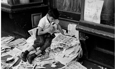 ---Boy reading newspaper, New York, 1944 Photograph: The Estate of André Kertész/Courtesy of Stephen Bulger Gallery One of my favourite André Kertész photographs shows two young men sitting with their backs to a tree, each absorbed in a book. Both are wearing glasses; both use their thighs as a lectern; the one facing forwards is black, the other, in profile (a dead ringer for Woody Allen), is white. Their proximity suggests they know each other and are friends. And given the time and place of the composition, the photo could serve as an icon of the civil rights movement – racial harmony as observed in Washington Square, New York City, 1969. What's equally striking, though, is how separate the two men are, how oblivious to each other's presence (and to the camera). They might be friends but their real companions are their books. The Budapest-born Kertész enjoyed a long life (1894-1985), visited many countries and was involved in several different artistic movements. But wherever he went and whatever the commission, a constant preoccupation was with people reading. ---click image for source...