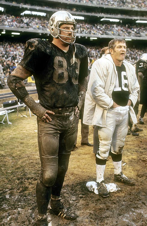 ---George Blanda (right) watches the action with Ben Davidson. Blanda spent nine seasons with the Raiders as a quarterback and placekicker while Davidson played defensive end for the franchise from 1964 to 1971. Read More: http://sportsillustrated.cnn.com/multimedia/photo_gallery/1011/oakland.raiders.rare.photos/content.1.html#ixzz2RBhxm600---
