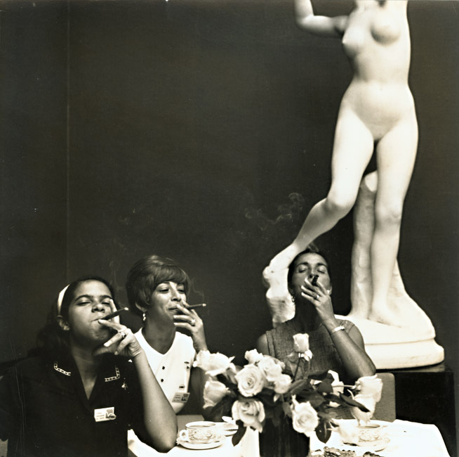 ---"Copenhagen: After luncheon at Carlsberg Brewery the ladies smoke cigars. They are guests from the Virgin Islands--once the Danish West Indies. Signed in ink on recto of the print in lower right margin. Fritz Henle was born on June 9, 1909 in Dortmund, Germany. About 1928 he took up photography. Henle immigrated to New York City and the United States in 1936 and became a naturalized citizen in 1942. He was a founding member and trustee of the American Society of Magazine Photographers (ASMP). He worked as a photographer for Life magazine from 1937 to 1942. ---